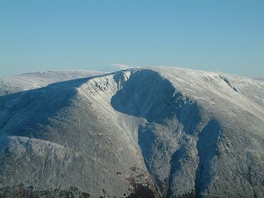 A distant view of Ben Macdui from Sgor an Lochain Uaine showing corrie where Anson DJ106 crashed in 1942, this view by the Sqn Ldr Dave Wilkie taken in November 2003. opyright D Wilkie.