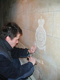 Robbie Smith, Stone mason, at work in Westminster Abbey as work on the memorial was near completion.